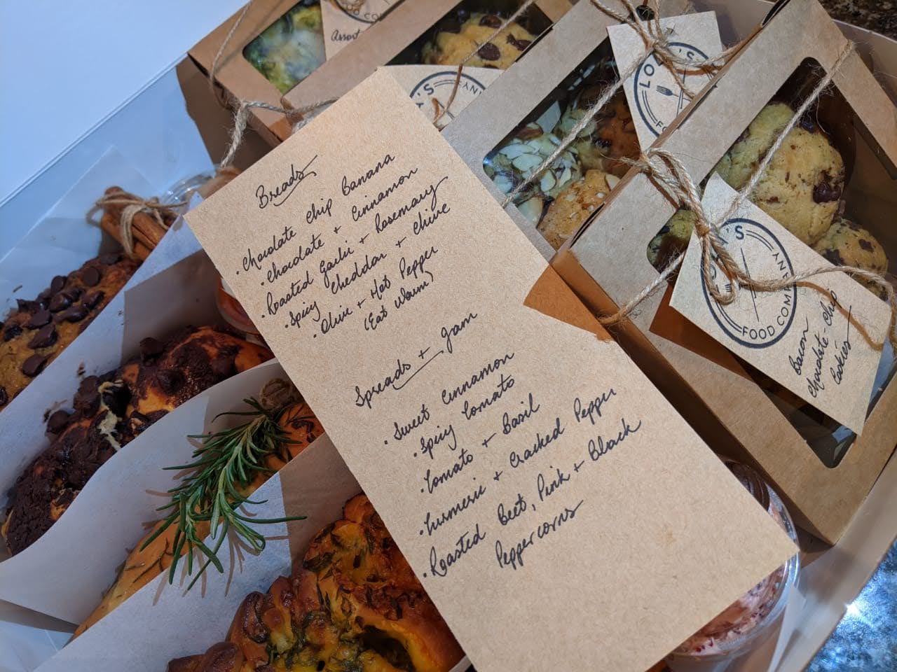 Assorted breads, spreads, and cookie boxes