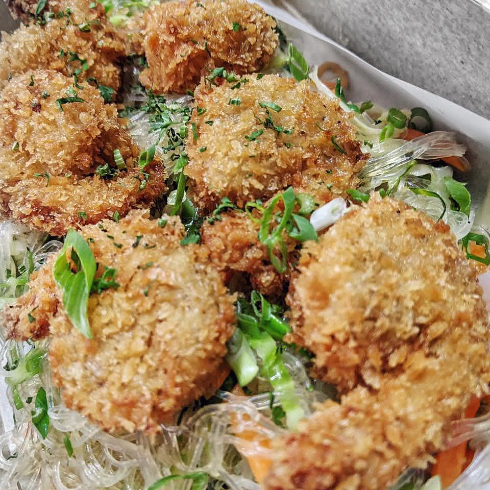 Crispy fried shrimp over noodles