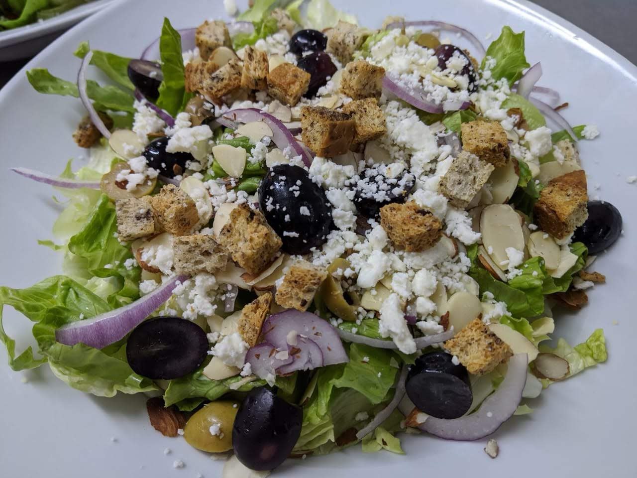 House salad with feta, grapes, and almonds